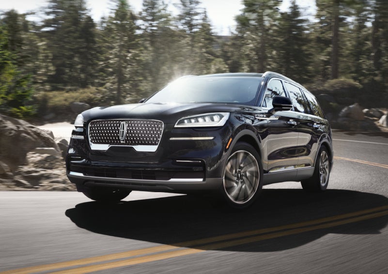 A Lincoln Aviator® SUV is being driven on a winding mountain road | Angela Krause Lincoln of Alpharetta in Alpharetta GA